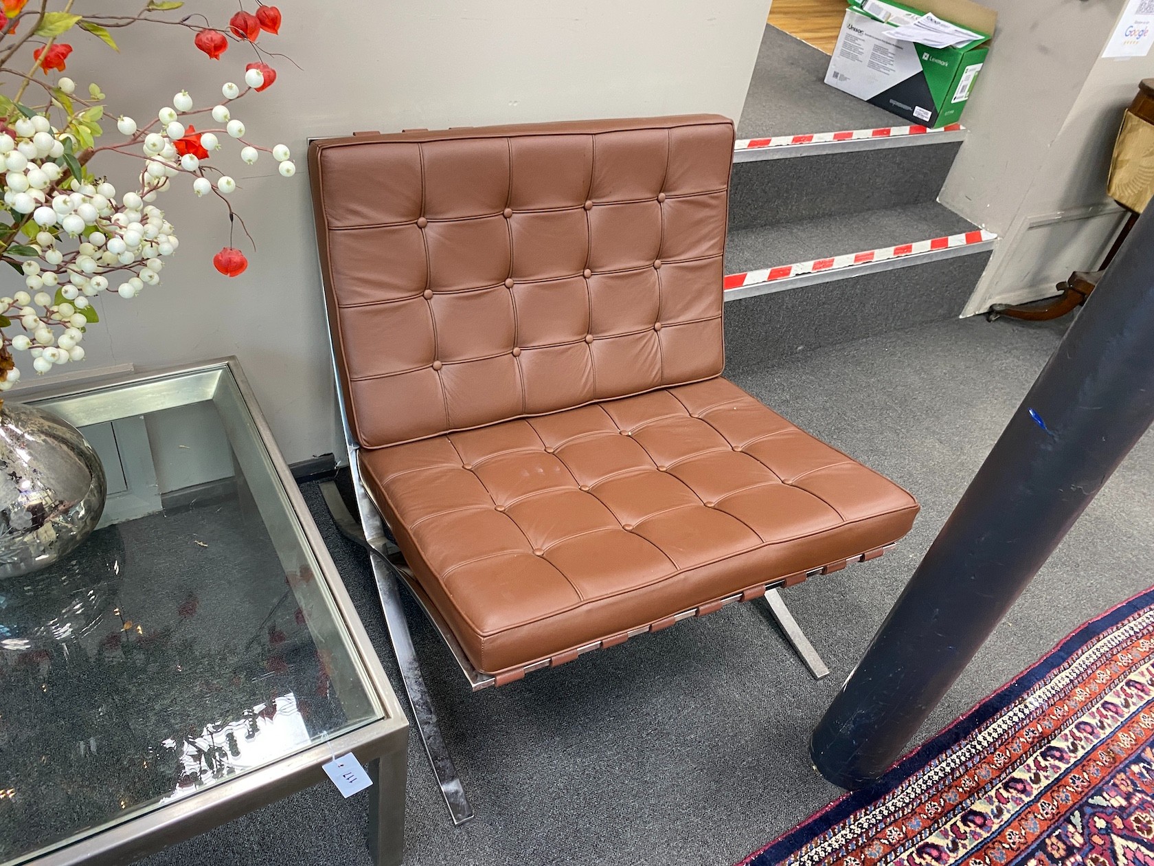 A pair of Barcelona style brown leather and chrome chairs, width 76cm, depth 78cm, height 73cm